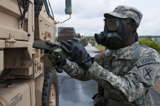 A US Army using a radiation detection equipment