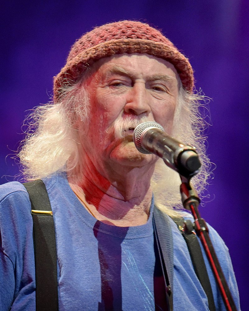 A picture of David Crosby performing at an event
