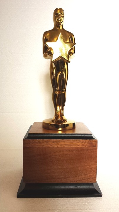 a closeup of a golden award statuette