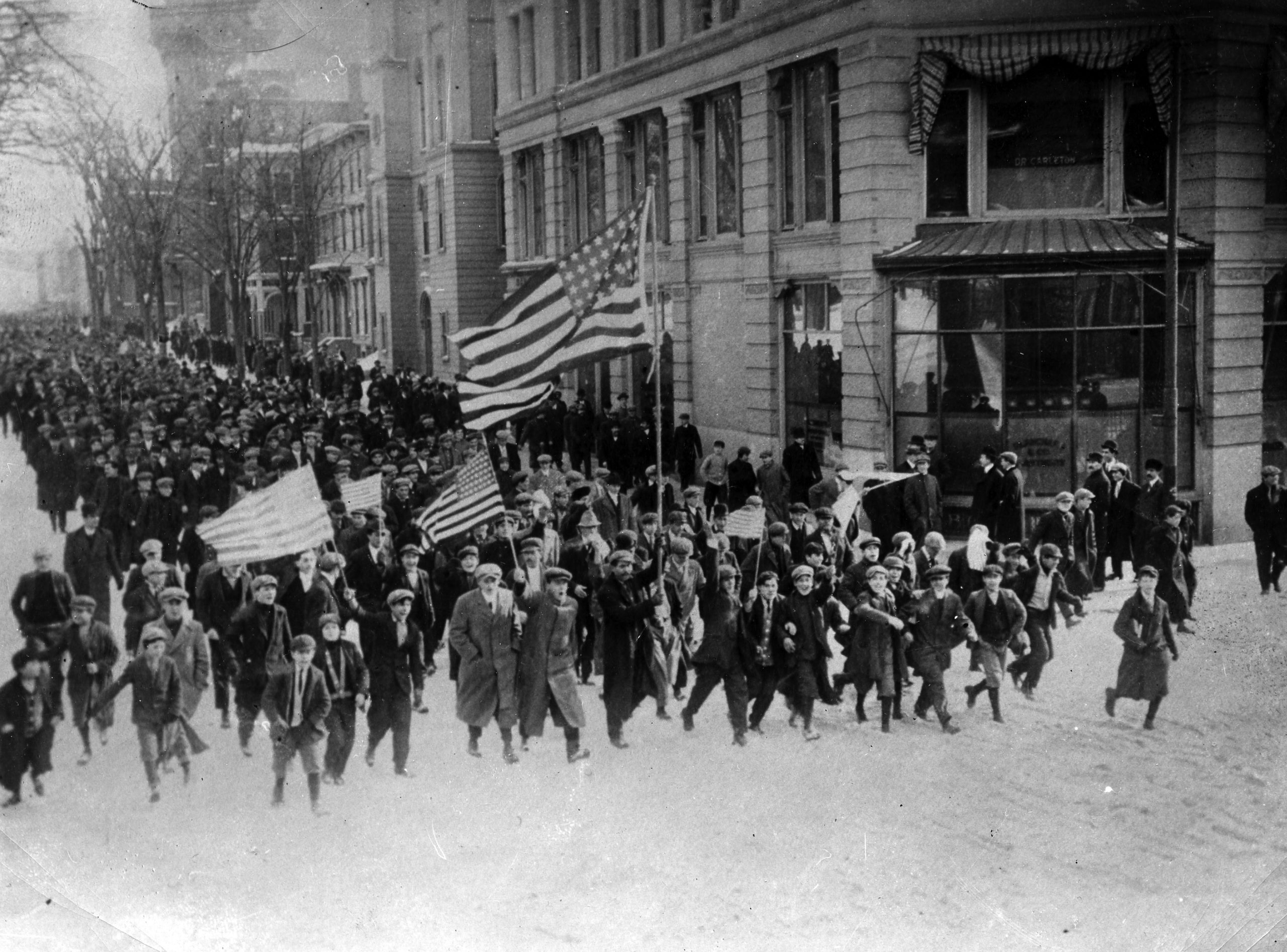 Strikers marching down the street in Lawrence, Massachusetts during the 1912 strike.