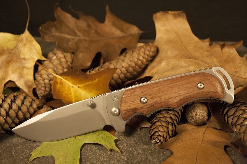 a hunting knife with a wooden butt