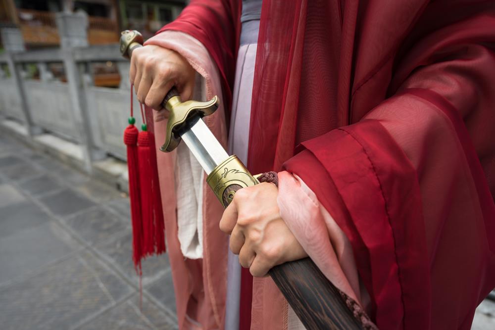 A Chinese warrior drawing a sword out