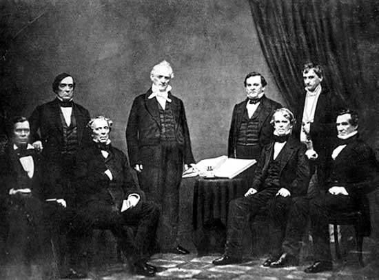 President Buchanan and his Cabinet, photograph by Mathew Brady (c. 1859). From left to right: Jacob Thompson, Lewis Cass, John B. Floyd, James Buchanan, Howell Cobb, Isaac Toucey, Joseph Holt and Jeremiah S. Black