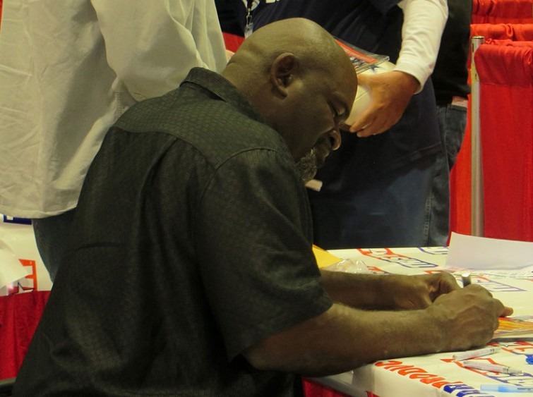 Lawrence Taylor signing an autograph in Houston