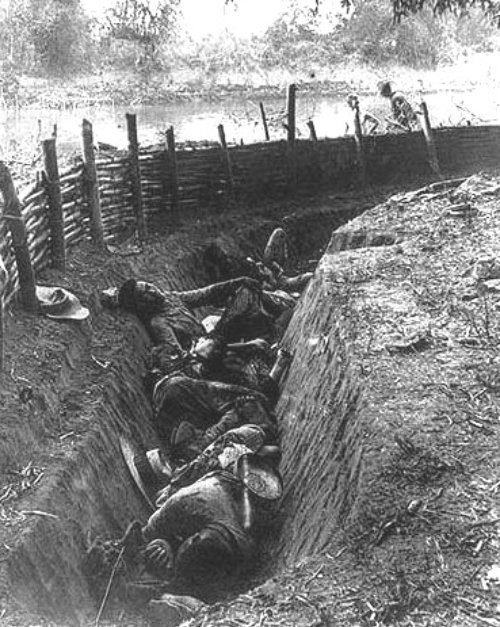 Fallen Filipinos in a trench on the north bank of the Bagbag River