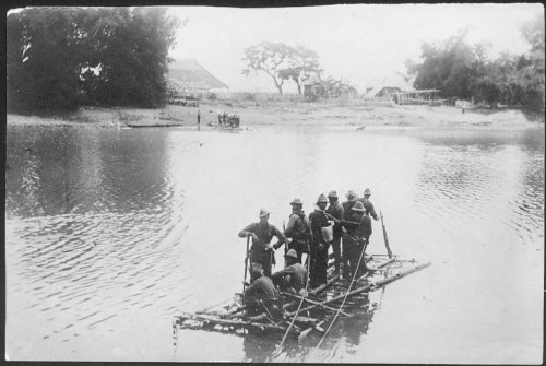 Col. Frederick Funston and some of his men rafting across the <EM>Rio Grande de Pampanga </EM>after the battle of Calumpit