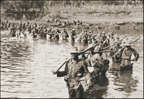 1st Nebraska Volunteers crossing a river during their advance against the Filipinos at Quingua