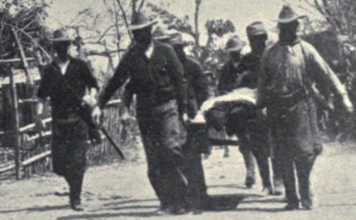 Americans carrying a dead comrade from the battlefield, somewhere in Central Luzon Island, 1899.