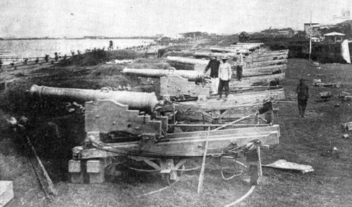 Battery of old Spanish guns on the Manila city wall, 1898
