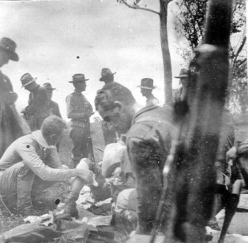 Caring for wounded American soldier in Misamis circa 1900-1901 in 2Lt. Robert B