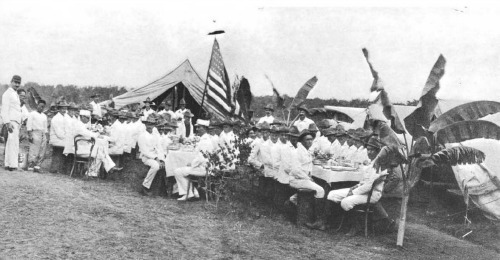 Company E 1st Nebraska enjoying Xmas dinner at Camp Santa Mesa, Dec. 25, 1898