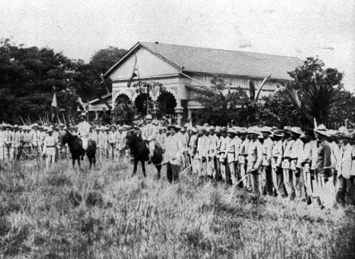 Filipino soldiers with 2 on horseback