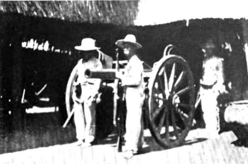 Filipinos with captured Spanish fieldpiece