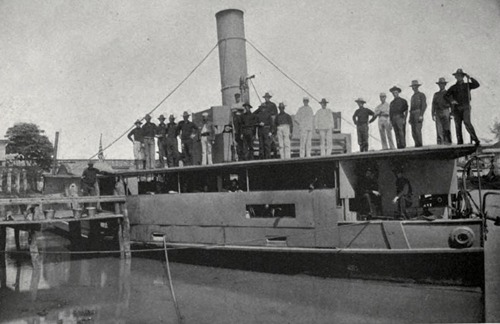 Gunboat Laguna de Bay with men on roof, 1899
