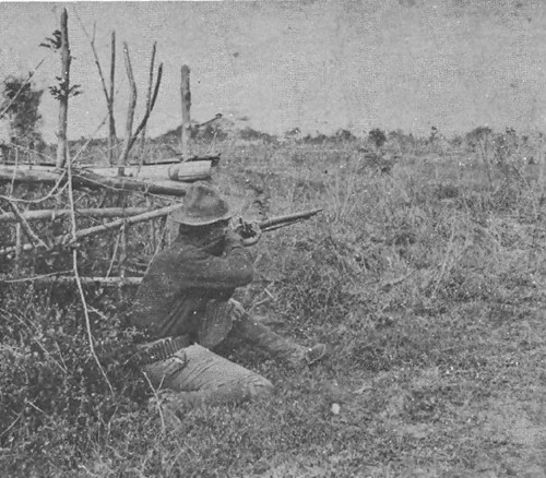 Pvt William W Grayson in firing pose at Santa Mesa, 1899