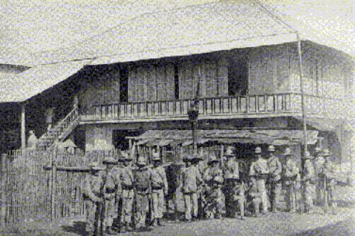 Spanish troops in Manila front of house