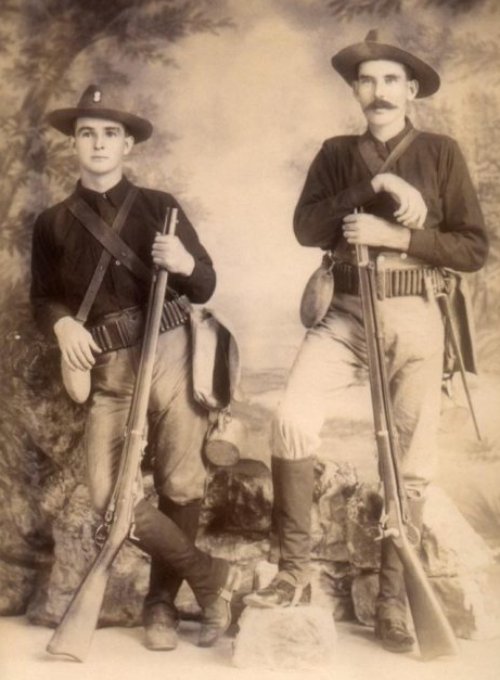 Two US soldiers, studio, 45 70 Springfield Trapdoor rifles, ca 1898