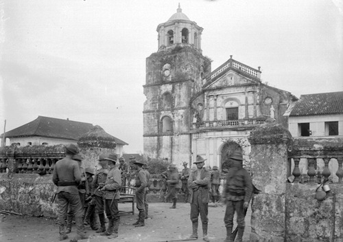 US troops at gate of Pasig church, March 17, 1899