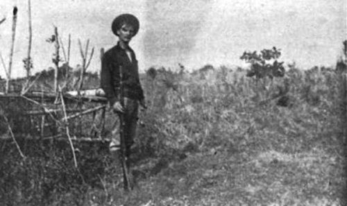 William W. Grayson standing with rifle Feb 1899