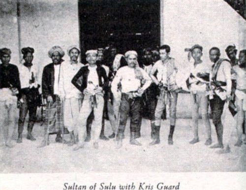 sultan of sulu with kris guard and representative moro warriors_edited