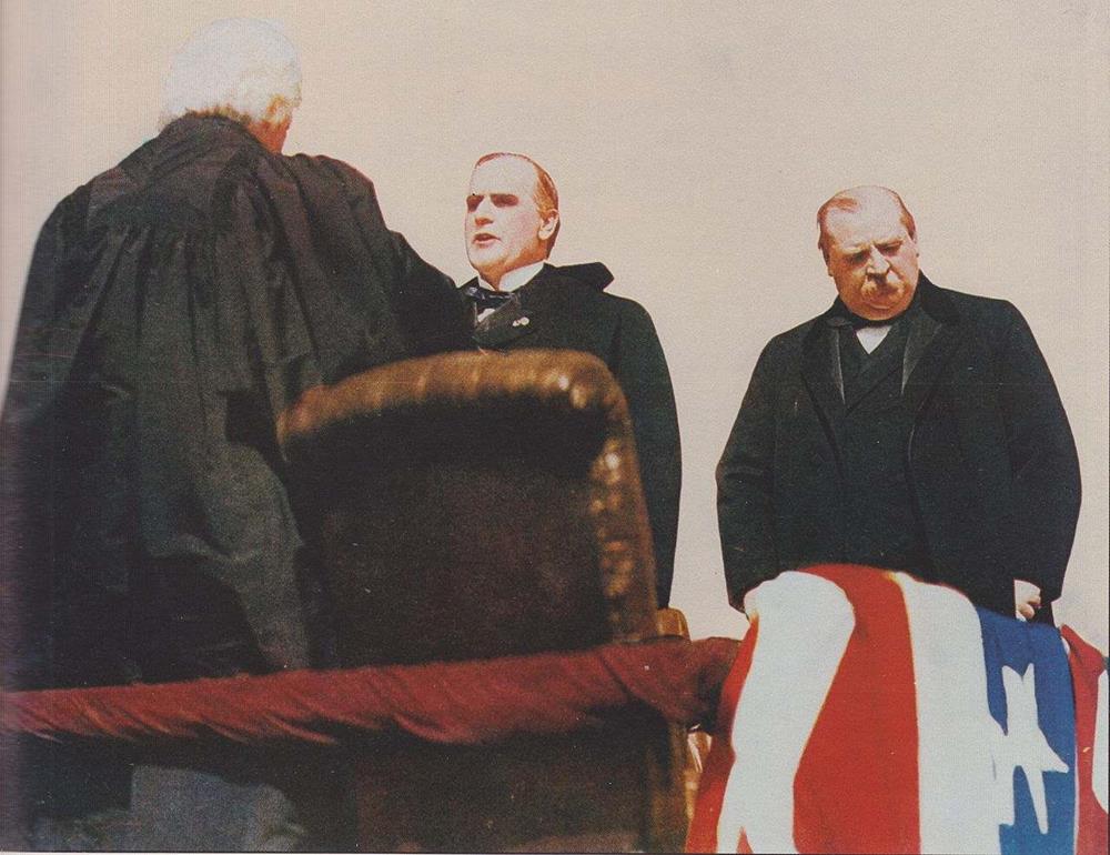 outgoing President Cleveland, at right, stands nearby as William McKinley is sworn in as president by Chief Justice Melville Fuller