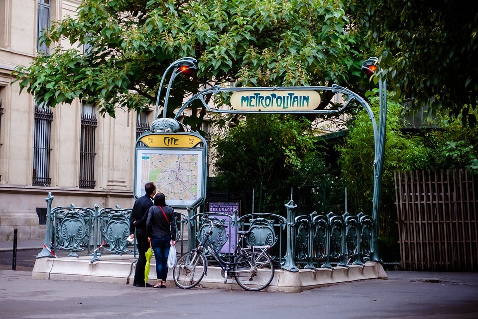 two people and a bicycle in Metropolitain, Paris