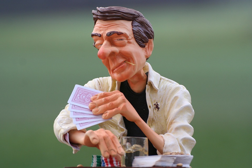 a figurine of a person gambling
