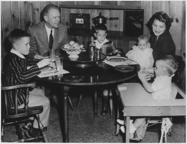 Gerald R. Ford, Jr., with Betty Ford and their children, sitting at the dining room