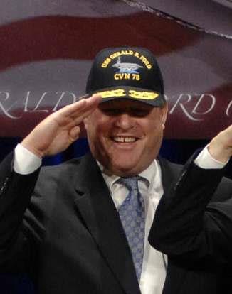 John "Jack" Gardner Ford salutes as a model of USS Gerald R. Ford (CVN-78) is unveiled