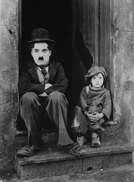 Charlie Chaplin in the silent film, The Kid in 1921