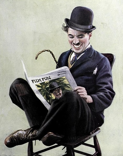 a portrait of Charlie Chaplin reading