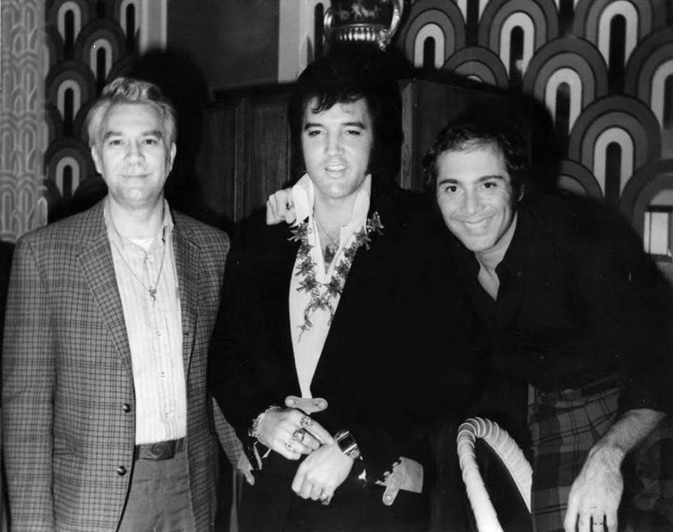 Elvis Presley (center) with friends Bill Porter (left) and Paul Anka (right) backstage at the Las Vegas Hilton on August 5, 1972