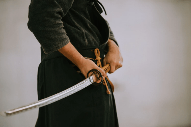 person holding a samurai