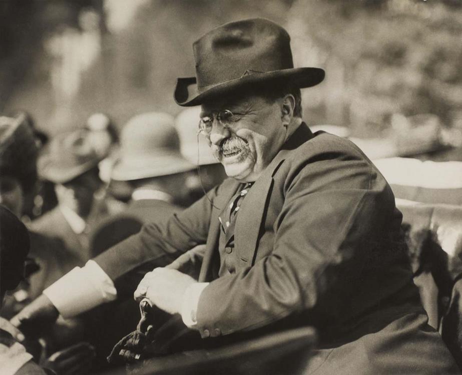 Theodore Roosevelt smiling from an automobile, 1910