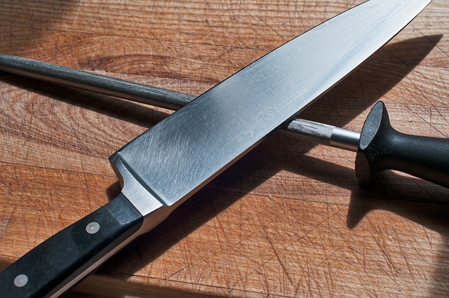 A kitchen knife and a knife sharpening tool