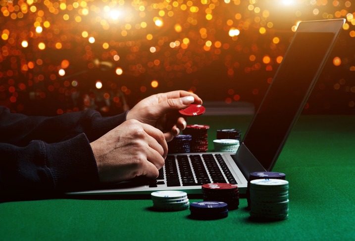Person playing online poker and looking winning cards. Concept win and lose in casino.