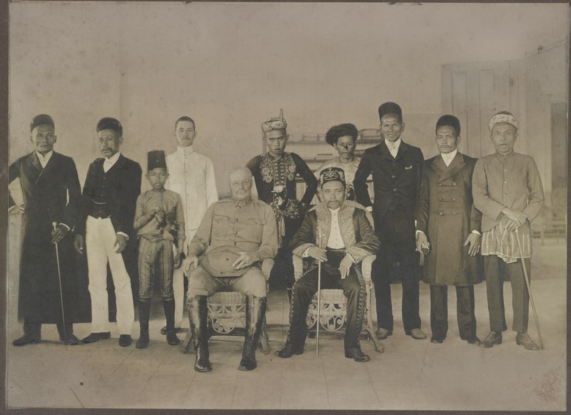 Major Hugh Scott, Military Governor of the Sulu Archipelago, Philippines, Sultan Jamalul Kiram II, interpreter Charles Schuck, and local government officials and hadjis