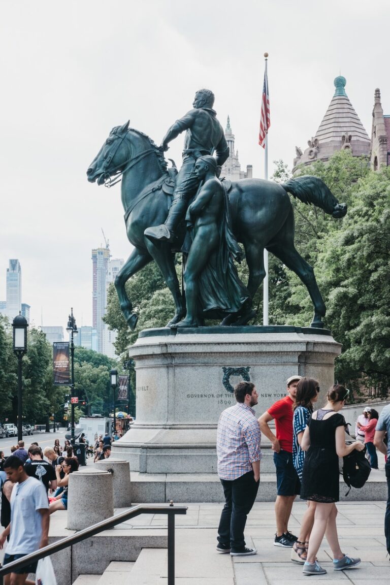People next to Theodore Roosevelt statue by The American Museum of Natural History in Manhattan, New York, USA.