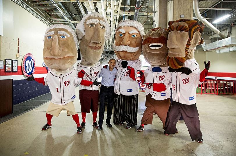 former US president Barack Obama photographed with the mascots of the Presidents Race