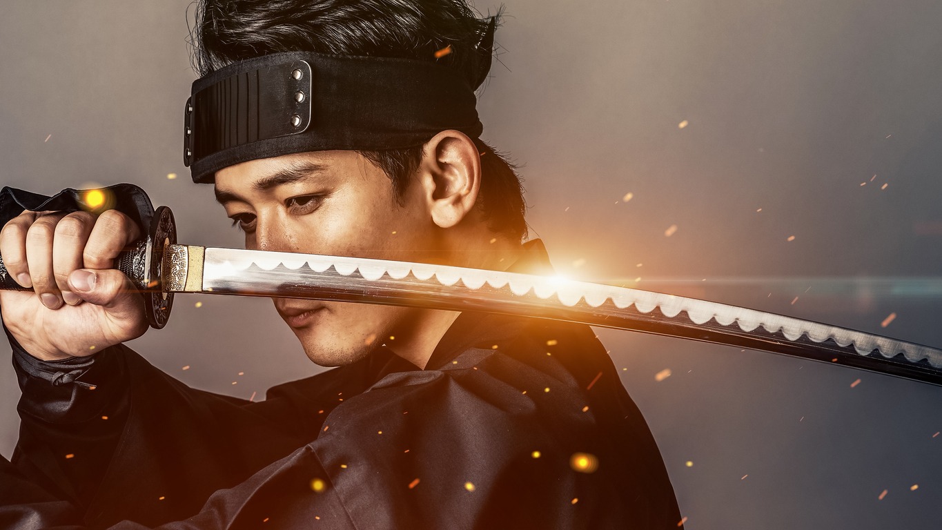Japanese samurai holding katana. Historical drama.