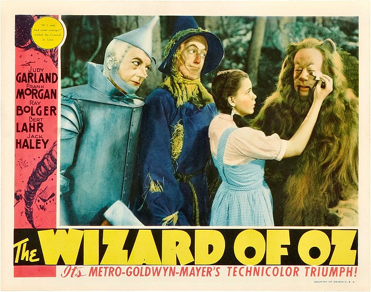 the main cast members of The Wizard of Oz featured in a lobby card